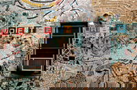 Since the 60's Philadelphia artist and '95 Pew Fellow Isaiah Zagar has been covering the buildings and sidestreets of South Street, Philadelphia, with tiles, bottles, bike tire rims, anything really. More on Zagar and his work, <a href="http://www.isaiahzagar.org/">his personal site</a> and <a href="http://www.pewarts.org/95/Zagar/">his Pew Fellow page</a>.