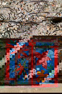 Since the 60's Philadelphia artist and '95 Pew Fellow Isaiah Zagar has been covering the buildings and sidestreets of South Street, Philadelphia, with tiles, bottles, bike tire rims, anything really. More on Zagar and his work, <a href="http://www.isaiahzagar.org/">his personal site</a> and <a href="http://www.pewarts.org/95/Zagar/">his Pew Fellow page</a>.