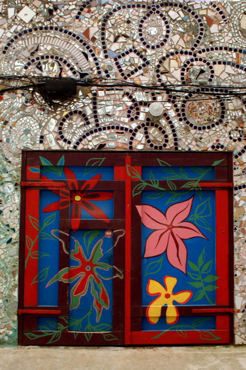 Since the 60's Philadelphia artist and '95 Pew Fellow Isaiah Zagar has been covering the buildings and sidestreets of South Street, Philadelphia, with tiles, bottles, bike tire rims, anything really. More on Zagar and his work, <a href="http://www.isaiahzagar.org/">his personal site</a> and <a href="http://www.pewarts.org/95/Zagar/">his Pew Fellow page</a>.