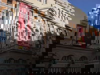 One of many theaters in Madrid, between Gran Via and Chueca. What made me take this picture, and I'm kicking myself for not zooming, was that in the third window (l to r) in the center of the building a guy all dressed up was posing in designer clothes and a couple guys were on the balcony underneath him telling him to look more sexy.