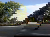 Near the center of the park. The Parque Del Retiro is the largest park in Madrid, and in terms of usability its much like Central park. Lots of open space, some sports fields, playgrounds, some places to buy food and drinks and, of course, tourists.