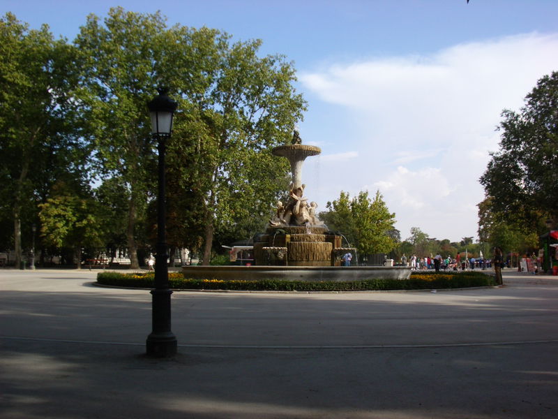 Near the center of the park. The Parque Del Retiro is the largest park in Madrid, and in terms of usability its much like Central park. Lots of open space, some sports fields, playgrounds, some places to buy food and drinks and, of course, tourists.