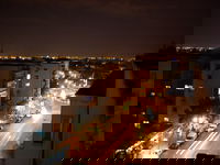 A picture of west madrid at night from above the metro stop Colombia.