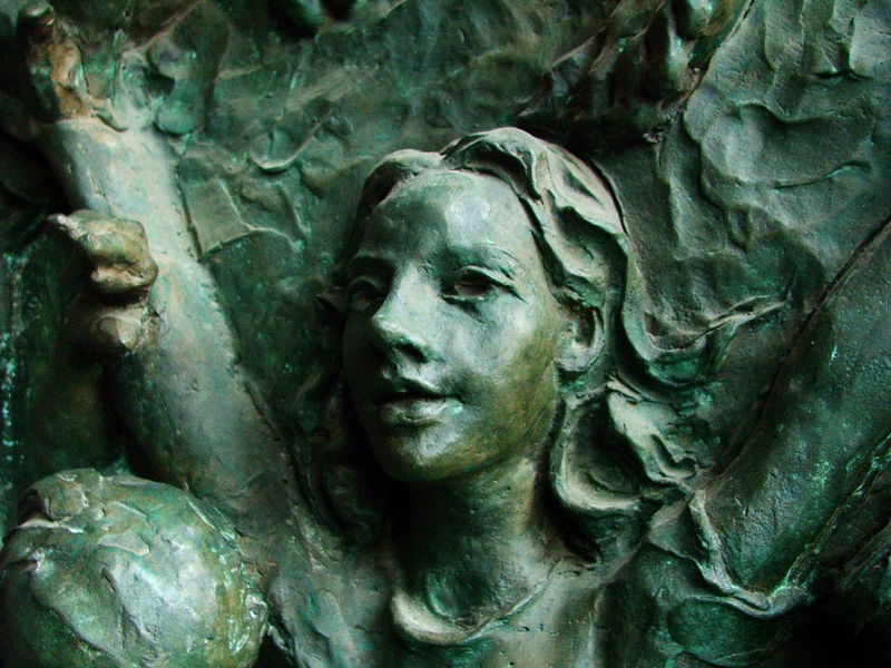 On the door to Nuestra Señora de la Almudena. The doors in general are covered in bronze reliefs, but this women/girl caught my eye especially.