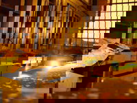 Stock room. Person with flashlight is <a href="http://flickr.com/photos/29262558@N00/">Ron</a>. The highlights on the cabinets are also from flashlights.