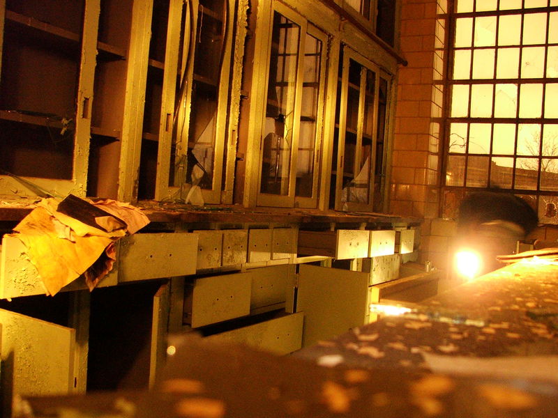 Stock room. Person with flashlight is <a href="http://flickr.com/photos/29262558@N00/">Ron</a>. The highlights on the cabinets are also from flashlights.